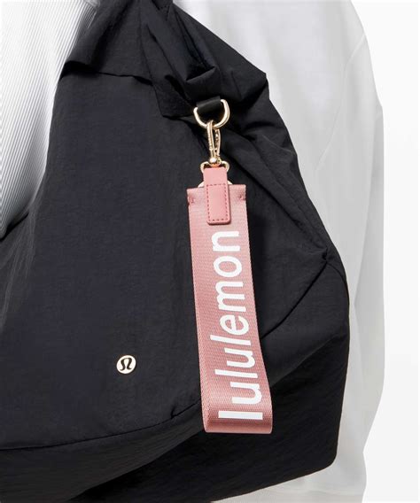 Accessories; Bags; Never Lost Keychain Designed for On the Move Colour VaporGold. . Lulu lemon keychain